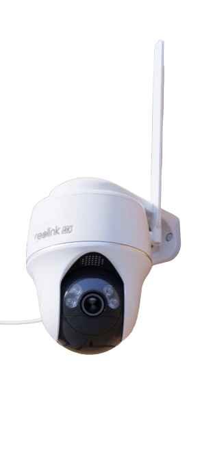 alt=1. A Reolink wireless security camera installed on the exterior wall of a house, ensuring enhanced surveillance and safety.