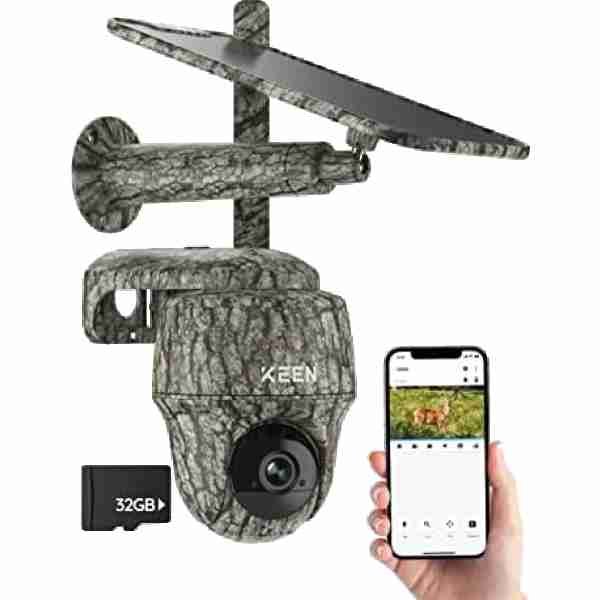 alt=Camouflaged trail camera with solar panel and smartphone showing camera view, with a 32GB memory card.