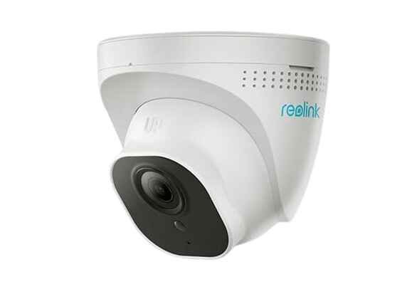 alt=1. A Reolink camera mounted on a window, capturing a scenic view of the mountains in the background.