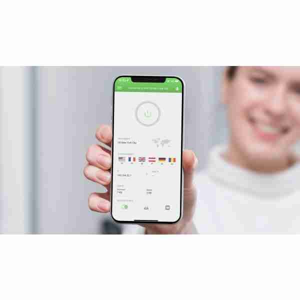 alt=1. A woman displays her smartphone featuring the PIA VPN app, emphasizing digital security and privacy.