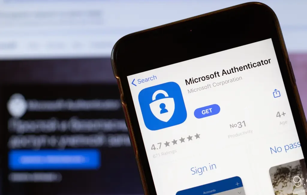 alt=A smartphone displays the Microsoft Authenticator app in the app store, highlighting ratings and downloading options.
