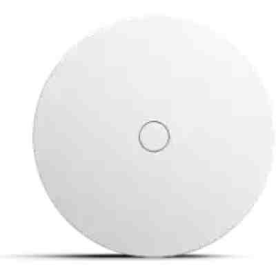 alt=A sleek white circular device with a small central button, designed for modern technology use.