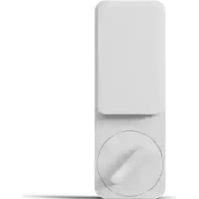 alt=A sleek white wall-mounted device with a rectangular top and a circular dial below for control or adjustment.