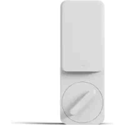 alt=A sleek white wall-mounted device with a rectangular top and a circular dial below for control or adjustment.