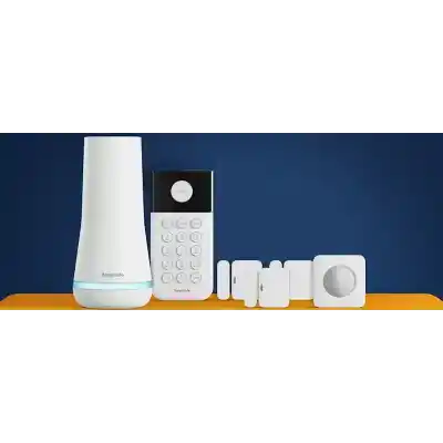 alt=A home security system from SimpliSafe, featuring a base station, keypad, and multiple sensors on a vibrant orange surface against a dark background.