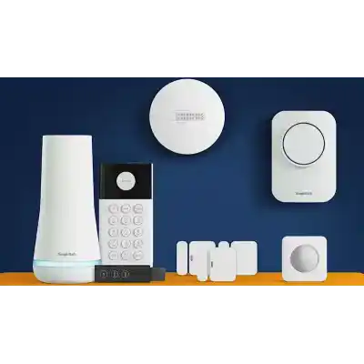 alt=A collection of SimpliSafe security devices on an orange surface, including a hub, keypad, sensors, and smoke detector against a blue background.